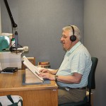 Photo of a volunteer reading and recording a book