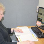 Photo of a volunteer monitoring a recording session